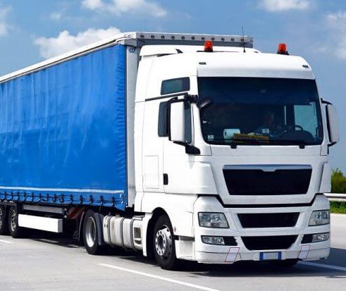 Blue and white road freight truck